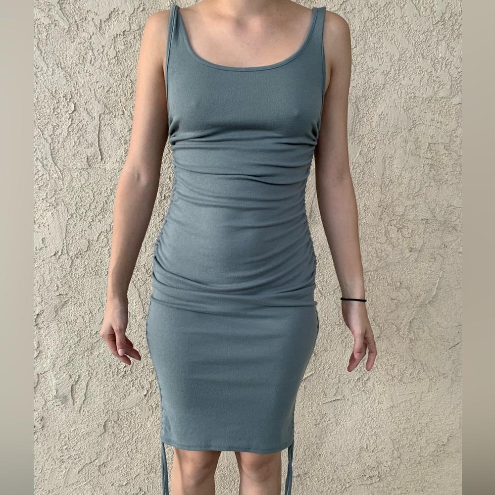 Adjustable on sides of dress. Grey. Wore only once.